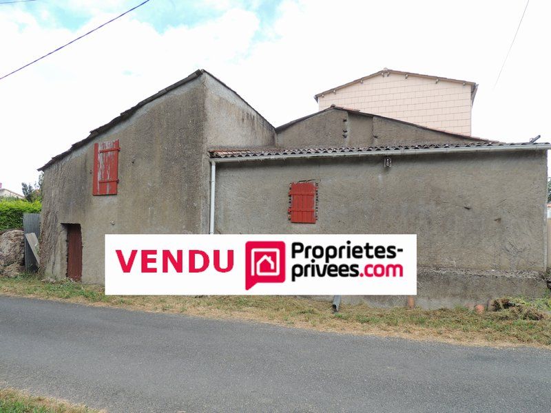 Bâtiment en pierres 100m² avec puits