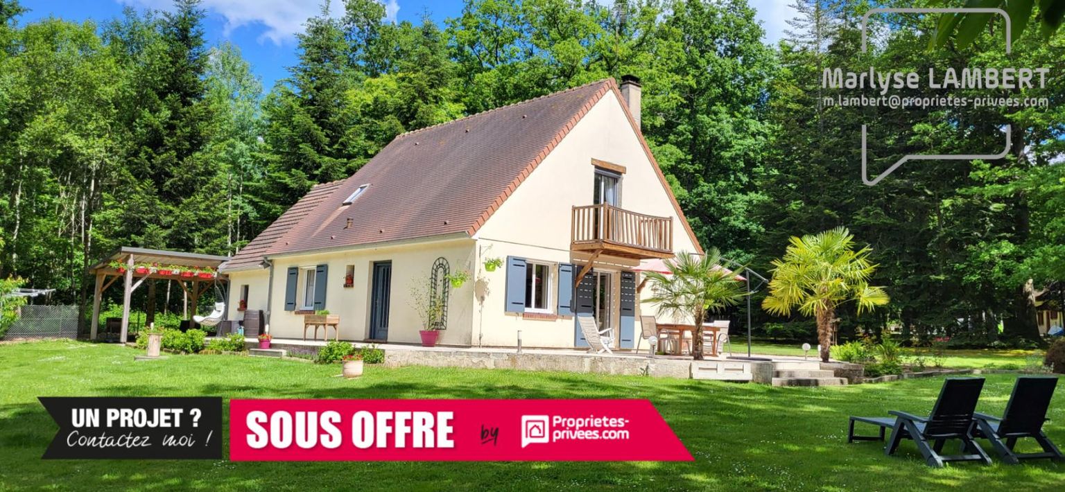 Maison sur terrain boisé