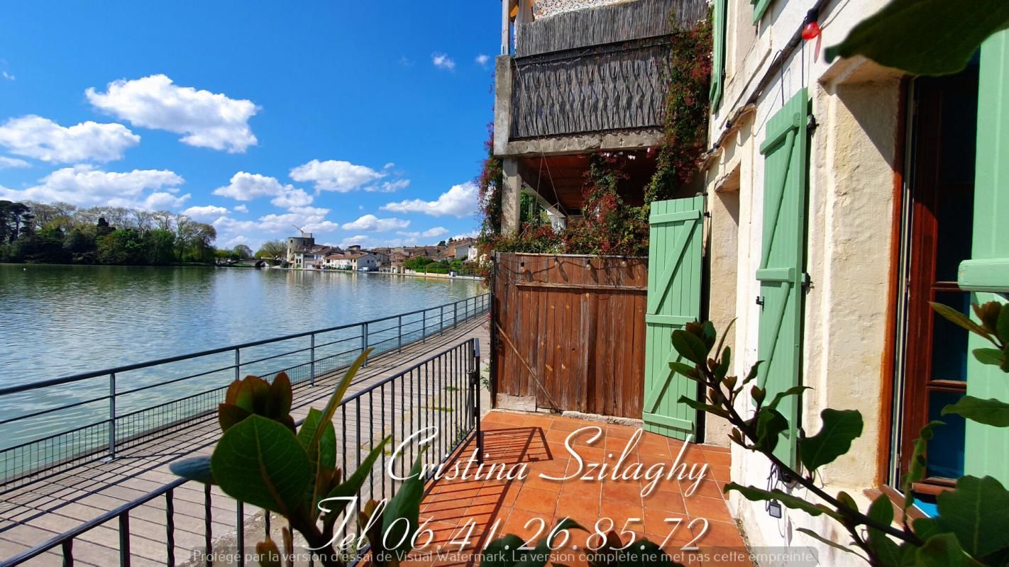 Superbe maison en bord de canal avec terrasse