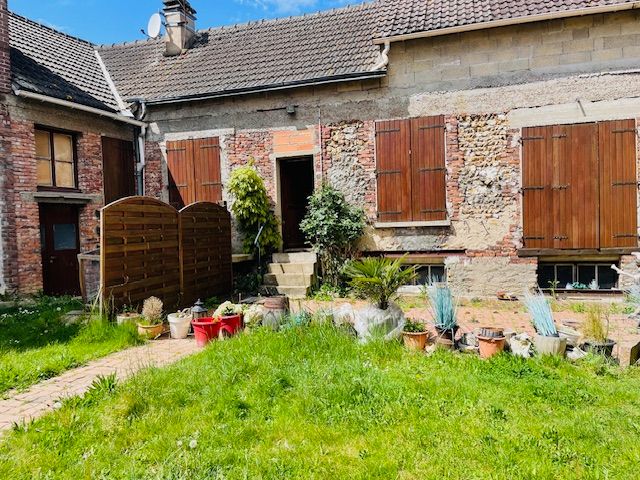 Maison de 170m2 plain pied avec commerce et immeuble