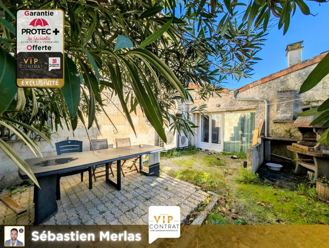 GARANTIE 12 MOIS OFFERTE ! Maison de ville avec garage et grand jardin !