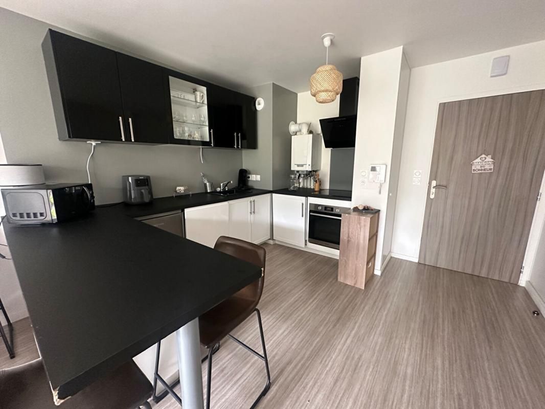 PONT-L'EVEQUE Appartement  plein Sud avec rez de jardin privatif 3