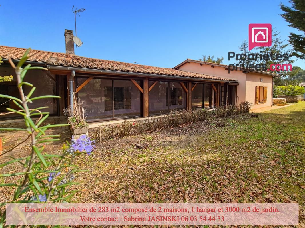 Ensemble immobilier, deux maisons, double garage et grand jardin