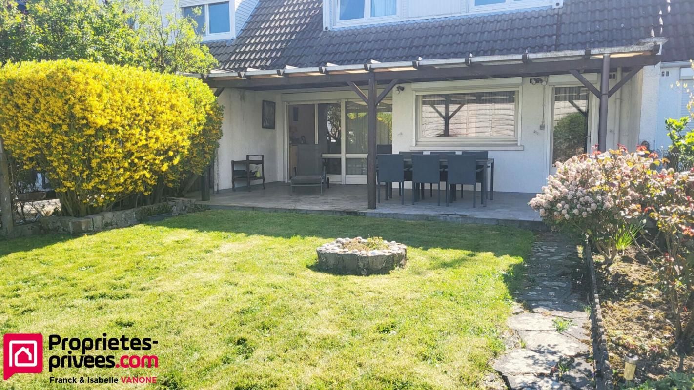 Maison traditionnelle - 3 chambres - garage - jardin - cave - 93m²