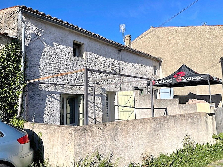 Ensemble immobilier 2 logements loués avec garage et espace extérieur