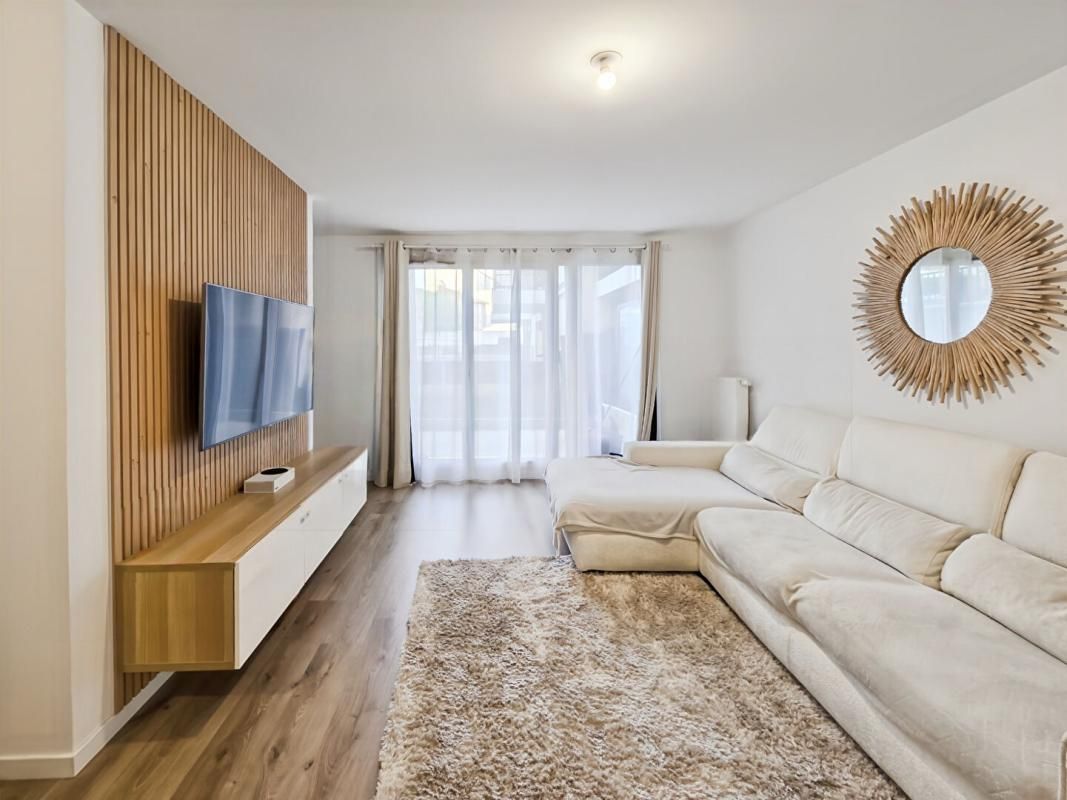 Appartement 3 pièces de 71 m2 avec jardin et 2 places de stationnement en sous-sol