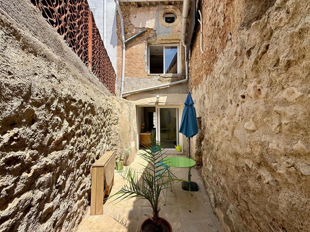 PUISSERGUIER Maison avec appartement, garage et cour à Puisserguier 2